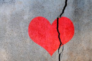 Broken heart on concrete wall