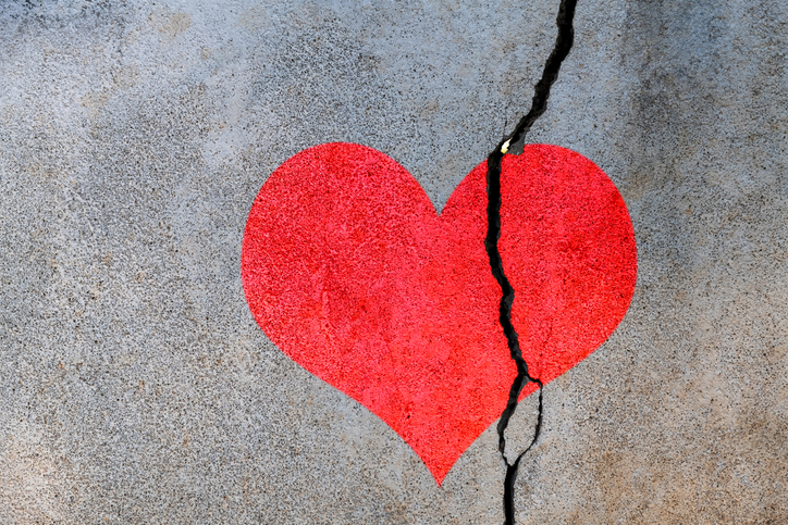 Broken heart on concrete wall